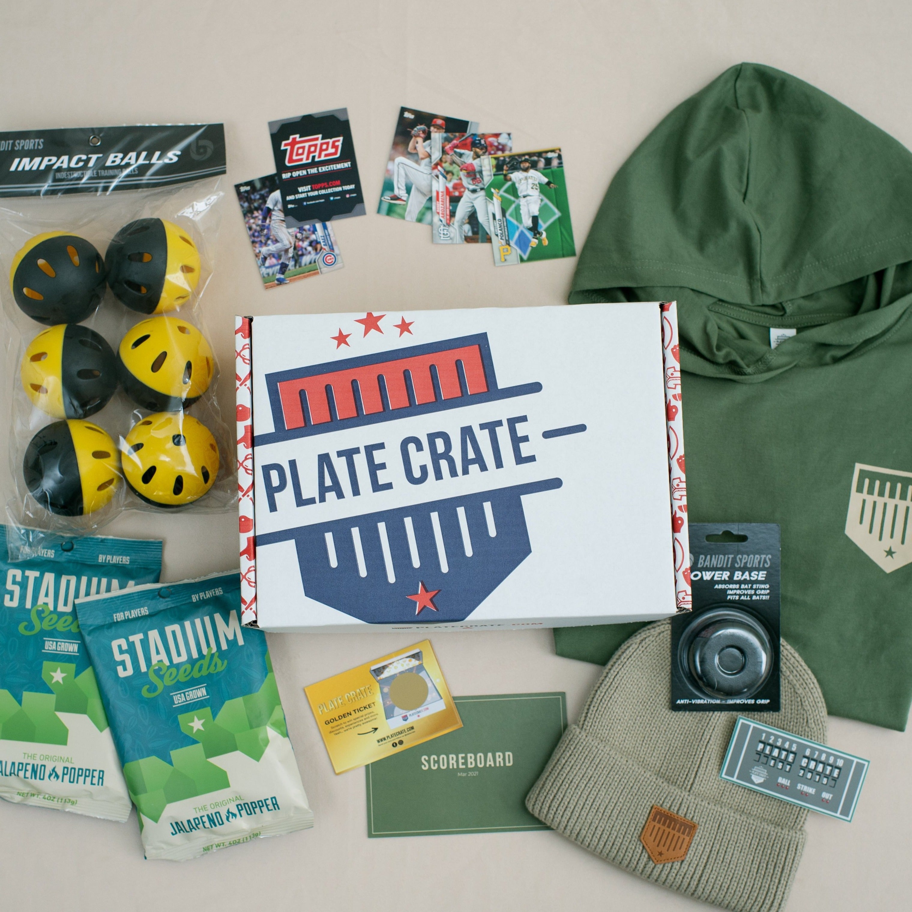March Scoreboard Crate. Short Sleeve Hoodie, Impact Balls, Knit Hat, two bags of Jalapeño Popper Seeds, Topps Sample Pack, Power Base, Scoreboard Sticker